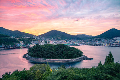 Scenic view of bay against sky during sunset