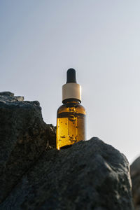 Low angle view of rock against sky