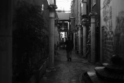 Full length of man walking in alley