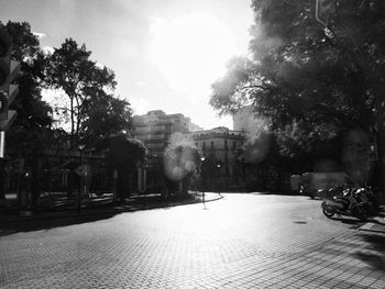 Street amidst buildings in city against sky