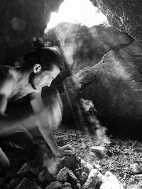 Young woman in cave