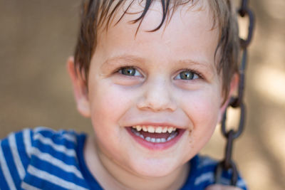 Close-up portrait of smiling boy