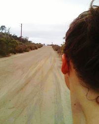 Woman walking on road