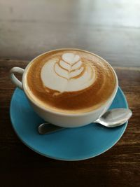 Close-up of cappuccino on table