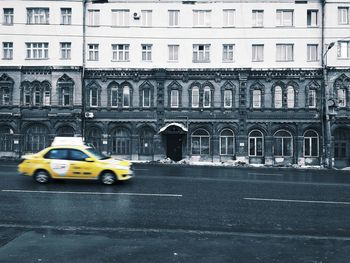 Yellow car on wet street