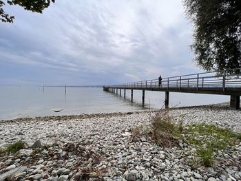 Bridge over sea against sky