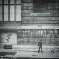 Woman standing in front of building