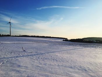 Scenic view of snow covered landscape against sky