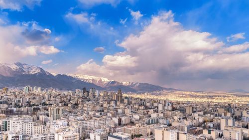 Aerial view of cityscape against sky