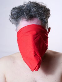 Close-up of woman with blond hair against white background