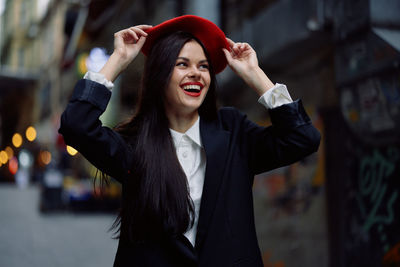 Portrait of young woman standing outdoors