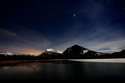 Scenic view of lake at night