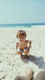 Portrait of smiling boy on beach