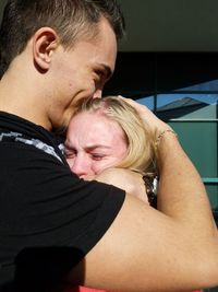 Young couple kissing at home
