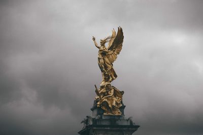 Low angle view of statue against sky