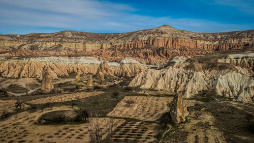 View of landscape with mountain range in background