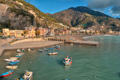 High angle view of sea and mountains against sky