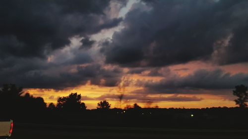 Scenic view of landscape against cloudy sky