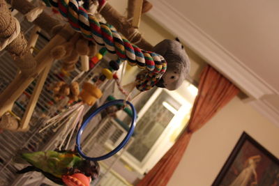 Low angle view of decorations hanging on ceiling in house