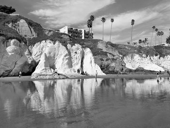 Scenic view of beach cliff against sky