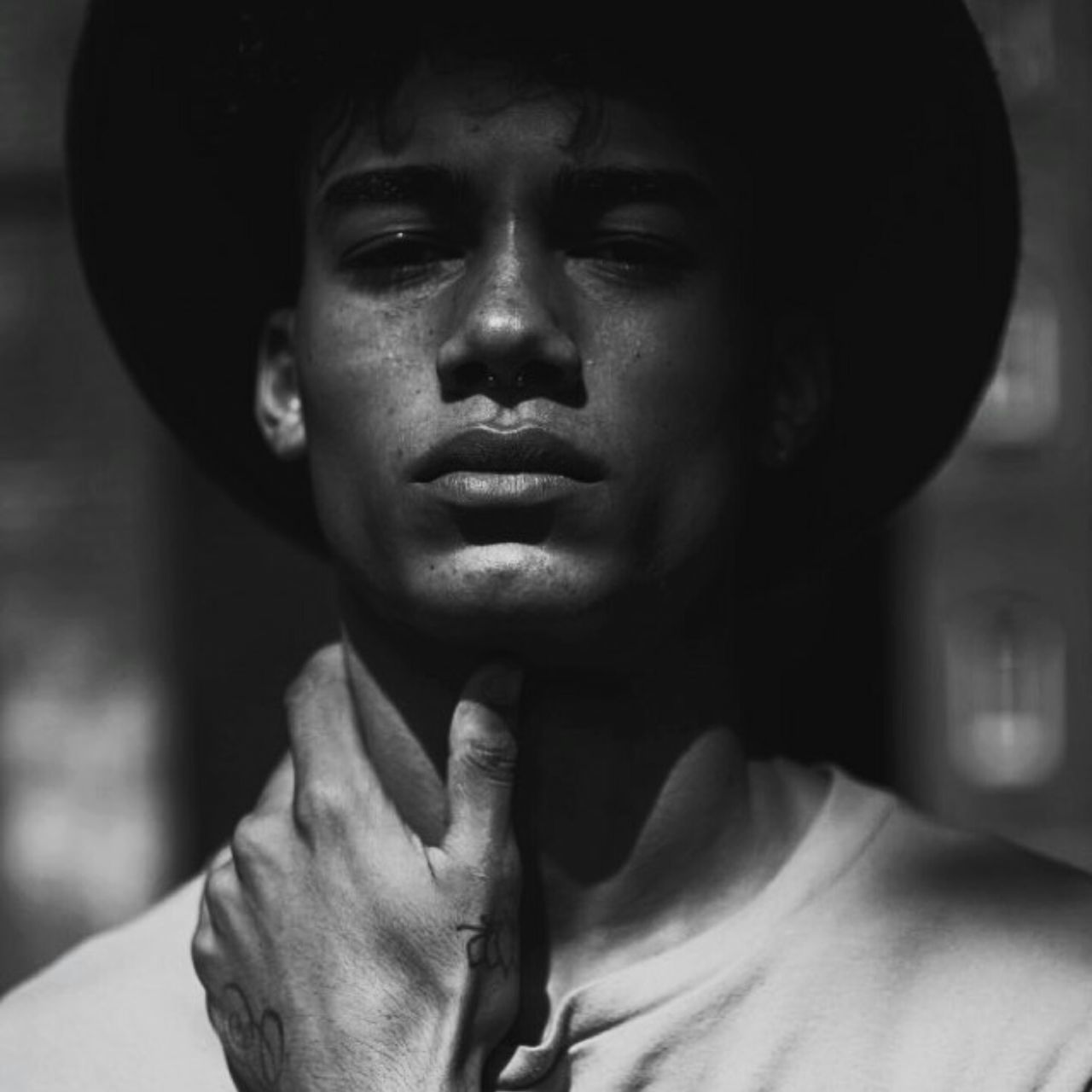 person, lifestyles, young adult, headshot, indoors, young men, front view, portrait, looking at camera, leisure activity, casual clothing, close-up, mid adult, smiling, mid adult men, head and shoulders, contemplation