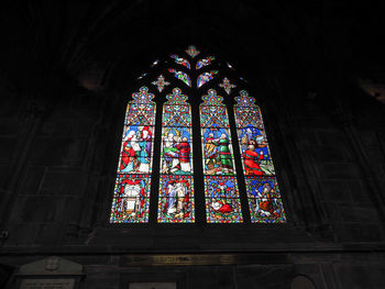 Low angle view of glass window in building