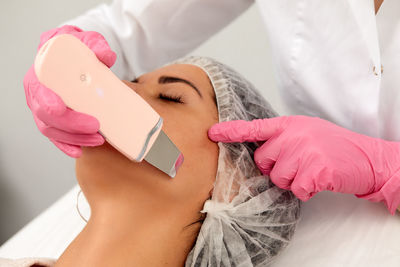 Midsection of doctor examining patient in hospital