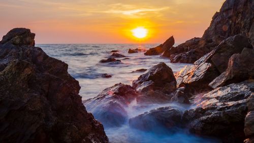 Scenic view of sea against sky during sunset