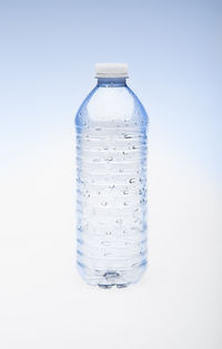 Close-up of water bottle against white background