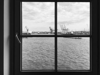 View of sea seen through window