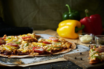 Close-up of pizza served on table