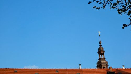 Low angle view of building against clear blue sky