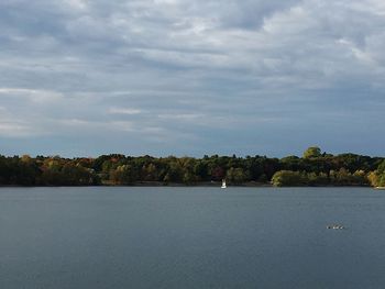 View of calm sea against cloudy sky