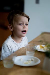 Portrait of boy eating food