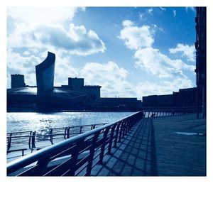 View of buildings against cloudy sky