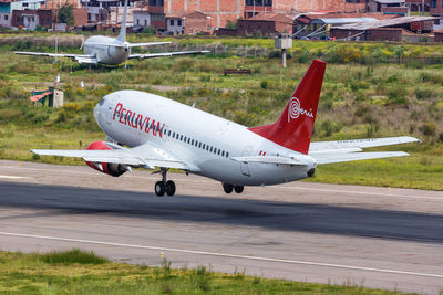 Side view of a airplane on runway