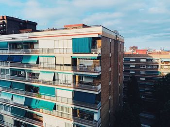 Exterior of modern buildings in city against sky