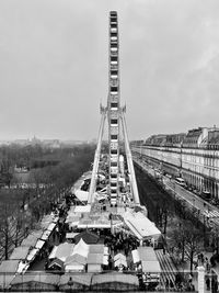 High angle view of cityscape against sky - la grande roue - les tuileries paris. 