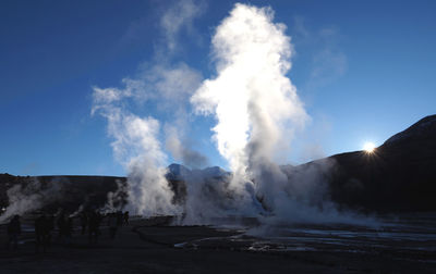 Panoramic view of people on landscape against sky