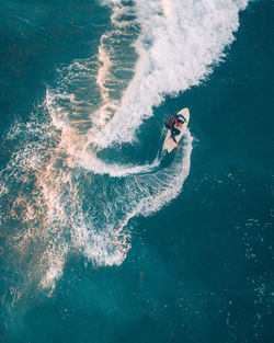 High angle view of woman swimming in pool