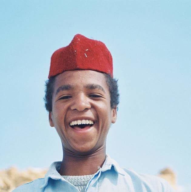 PORTRAIT OF SMILING MAN STANDING AGAINST CLEAR SKY