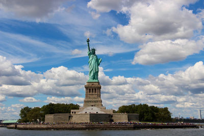 Low angle view of statue against cloudy sky