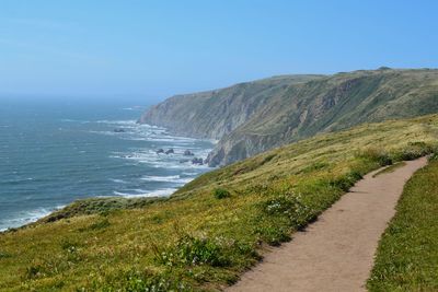Scenic view of sea against clear blue sky
