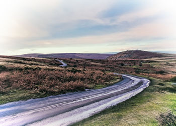 Scenic view of mountain road against sky