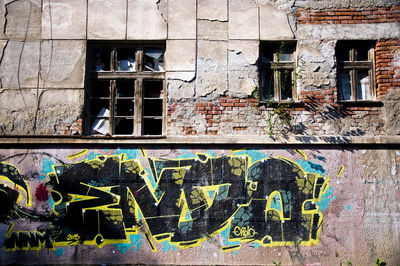 Graffiti on wall of old building
