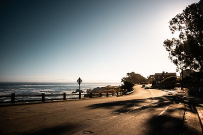 Scenic view of beach against sky in city