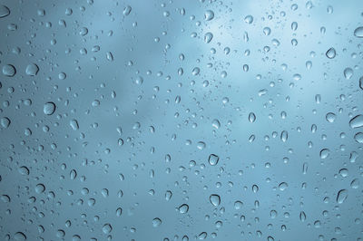 Full frame shot of wet glass window