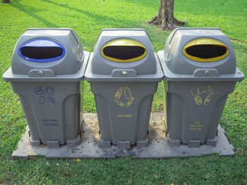 Garbage bin on field in park