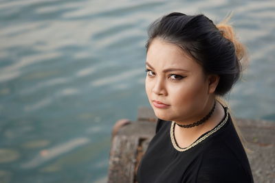 Portrait of woman on rock