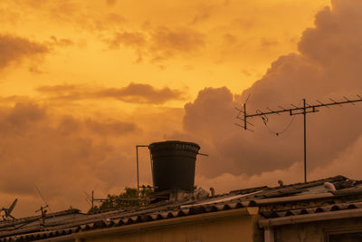 Low angle view of building against sky during sunset